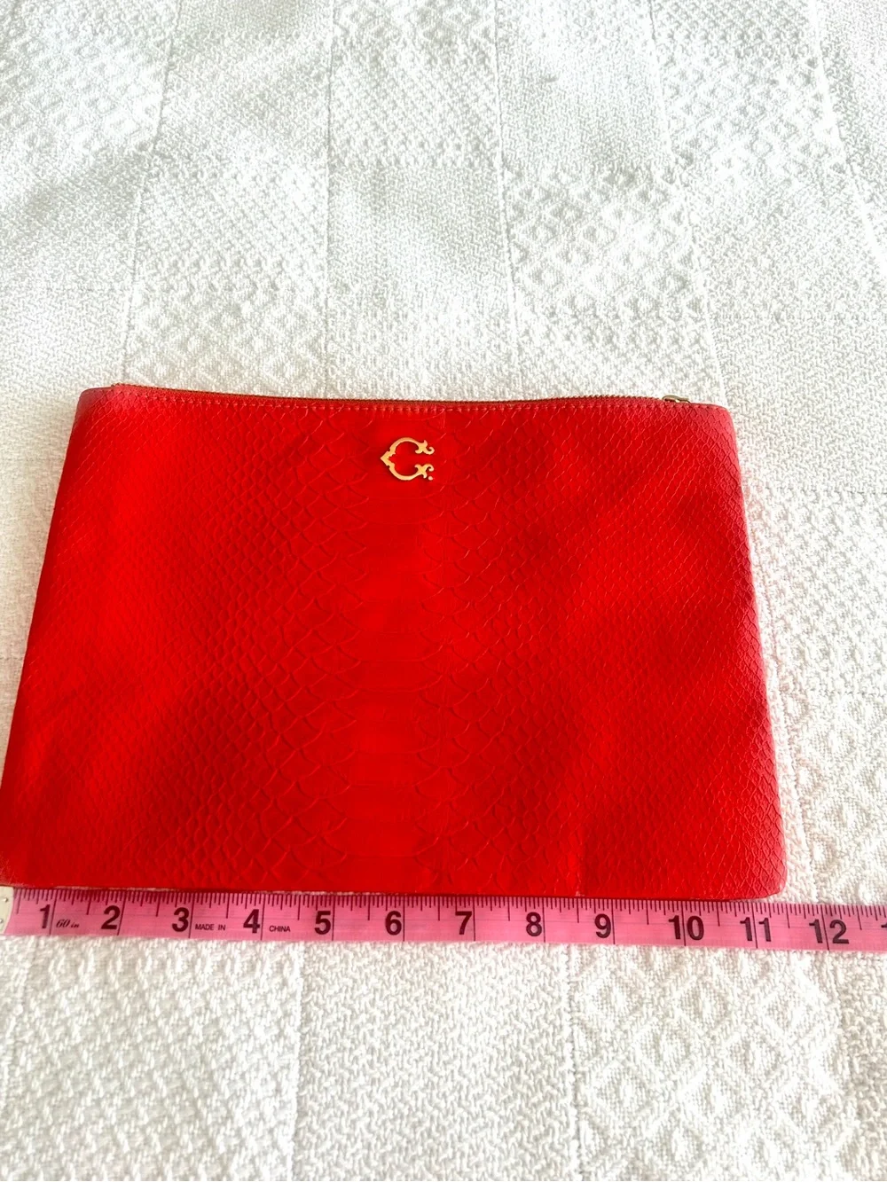 C. Wonder Clutch Orange Red Embossed Print Zip Close with Gold C Emblem